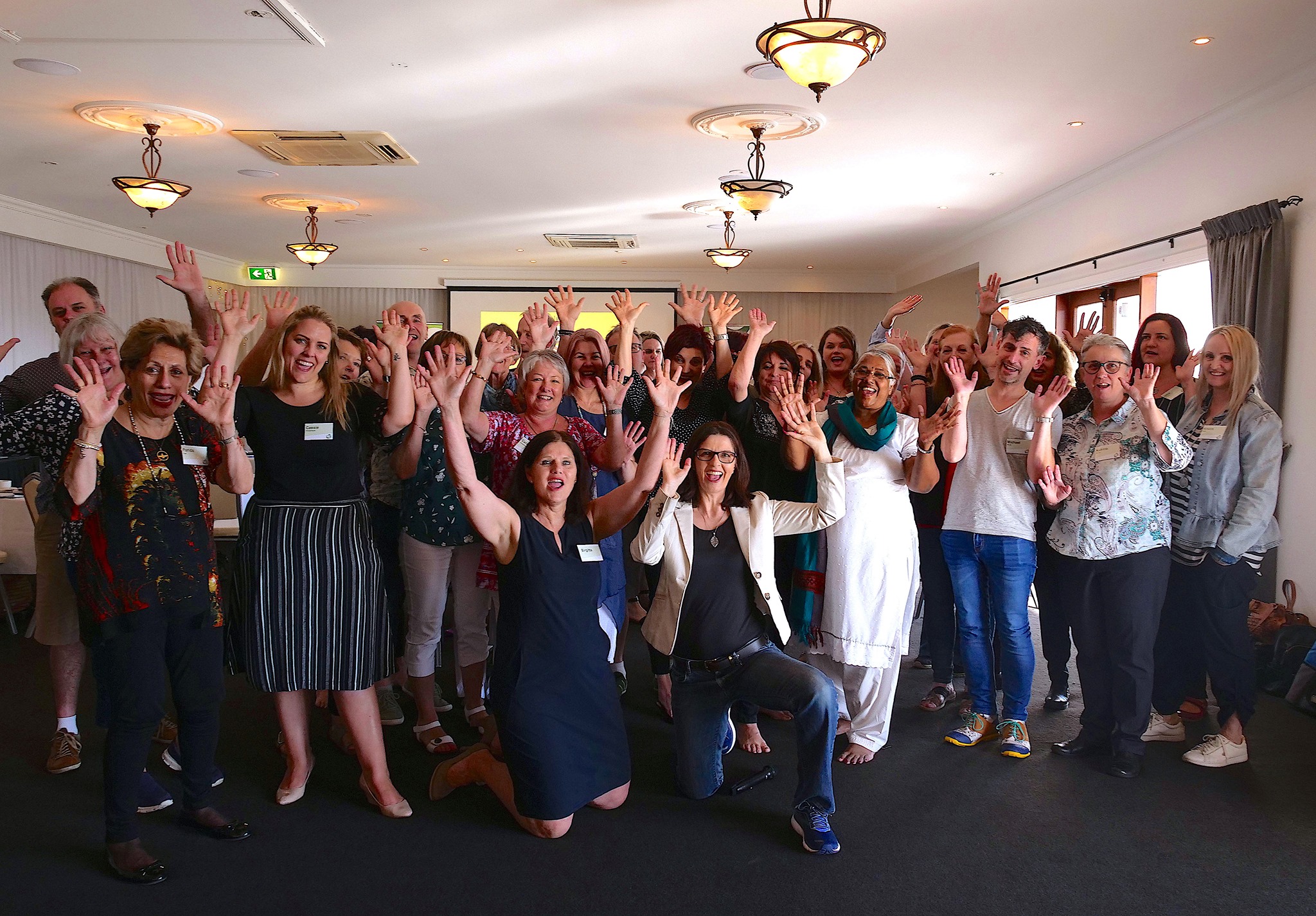 Bowen Training Australia instructors and staff group photo hands in the air